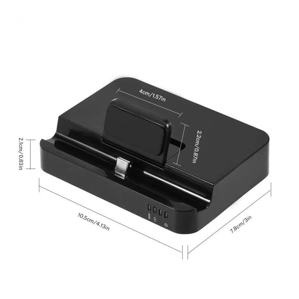 Black base mobile phone to HDMI converter dock for presentations on a desk.