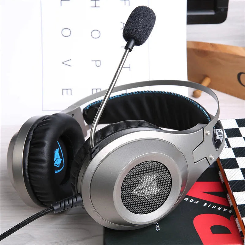 Black over-ear USB wired computer headset with microphone on a PC desktop
