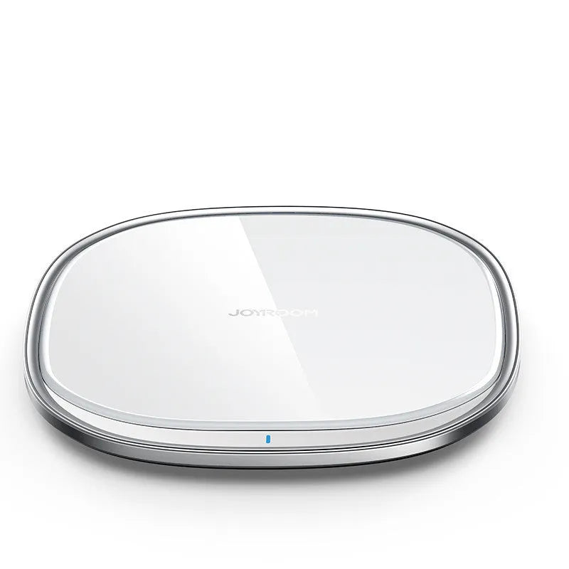 Black 15W Qi wireless charging pad with glass top and zinc alloy base on a desk.