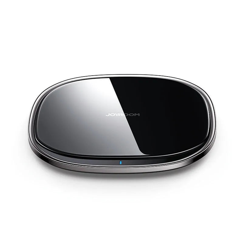Black 15W Qi wireless charging pad with glass top and zinc alloy base on a desk.