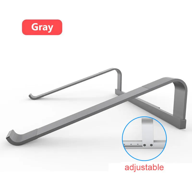 Aluminium alloy laptop air stand in silver hollowed out design supporting a notebook computer