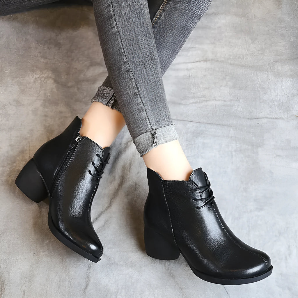 Women's brown retro leather Martin boots with a thick mid heel and round toe.
