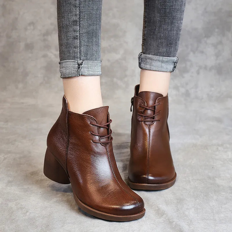 Women's brown retro leather Martin boots with a thick mid heel and round toe.
