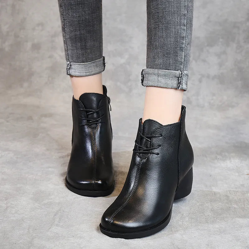 Women's brown retro leather Martin boots with a thick mid heel and round toe.