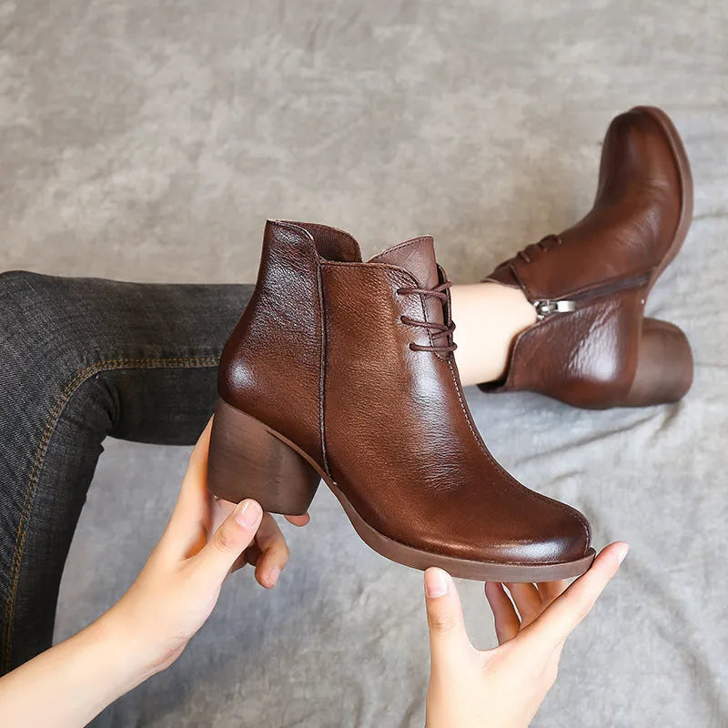 Women's brown retro leather Martin boots with a thick mid heel and round toe.