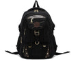 Canvas computer backpack in black with square vertical shape, zip closure, and multiple pockets