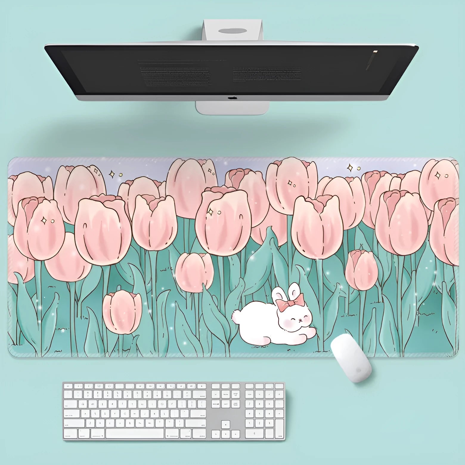 Large floral pattern mouse pad on a desk, showing non-slip rubber base and thin cloth surface.