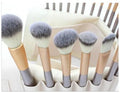 Persian makeup brush set with rice white bristles and champagne handles, shown in a 12-piece kit.