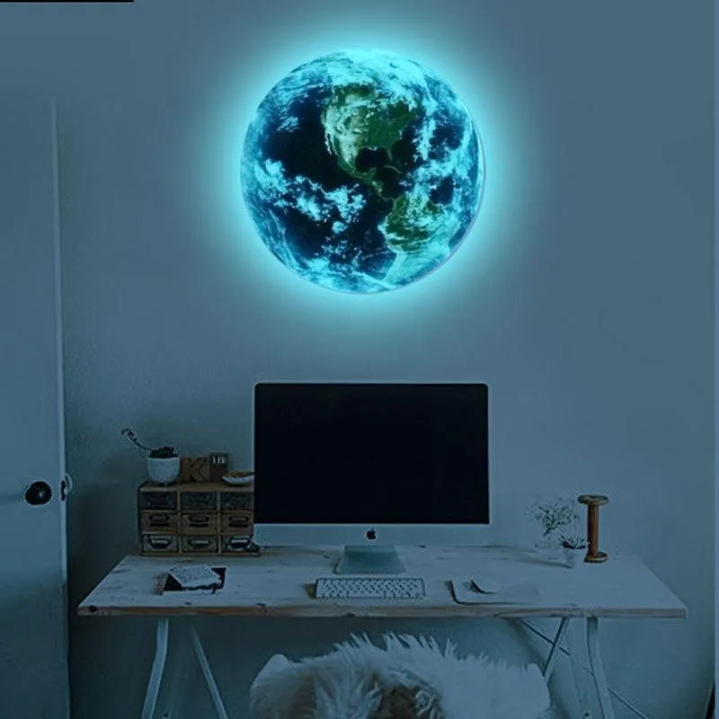 Glow in the dark 3D Earth planet wall sticker in three size options on a wall.
