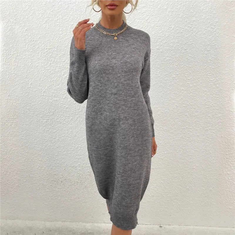Women's grey crew neck acrylic sweater with long sleeves laid flat