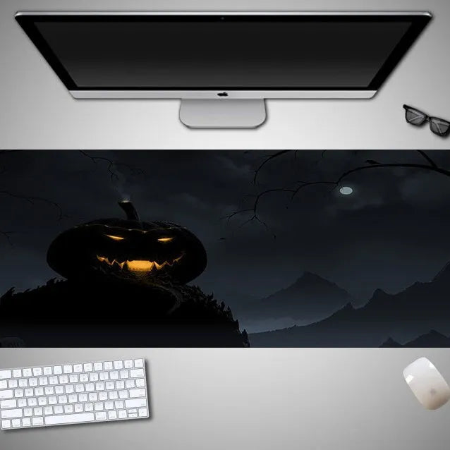 Oversized Halloween-themed gaming mouse pad with non-slip base on a desk.