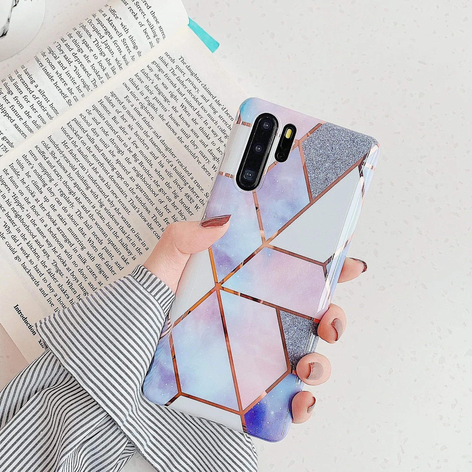 Electroplated marble pattern TPU phone case for Huawei and Samsung smartphones in various colours.