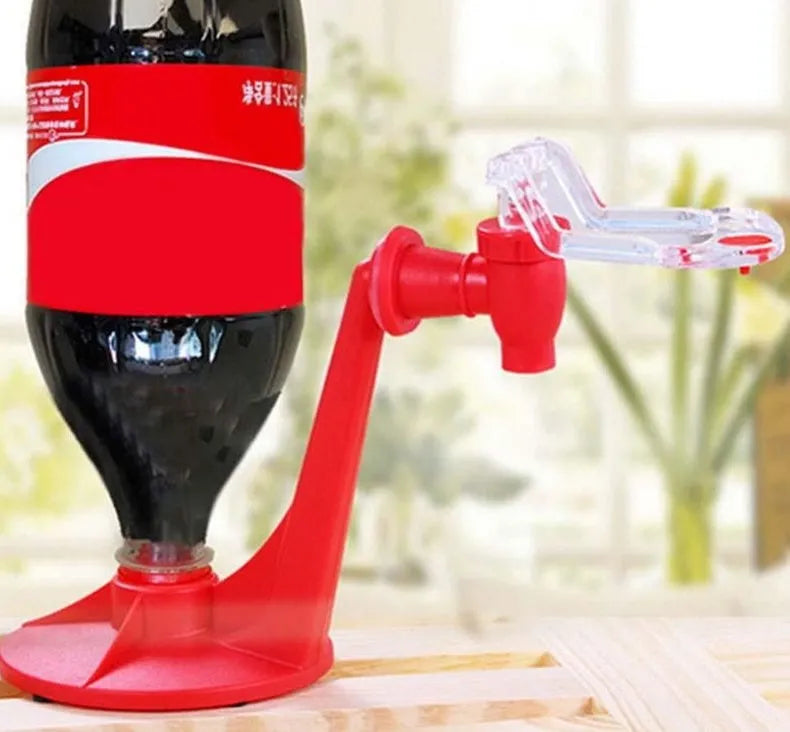 Red plastic Magic Tap soda bottle dispenser attached to a 2-litre bottle