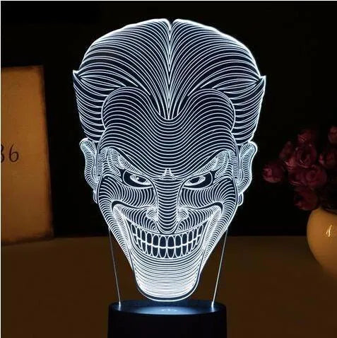 USB-powered 3D acrylic LED lamp showing colourful gradient illumination on a desk.