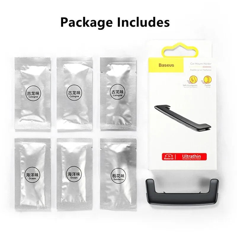 Pick-up car aroma clip in black attached to a car air vent diffusing a neutral scent