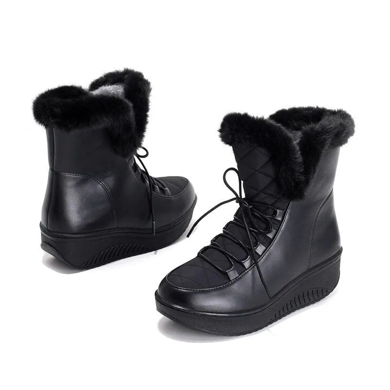 Black women's lace-up winter boots with platform sole on a white background