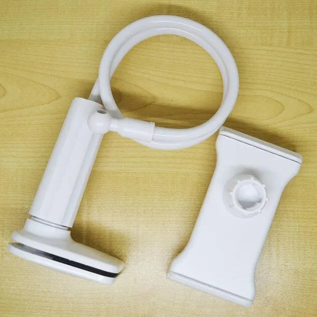 Black bedside phone holder with a long metal arm and adjustable plastic head gripping a mobile phone.