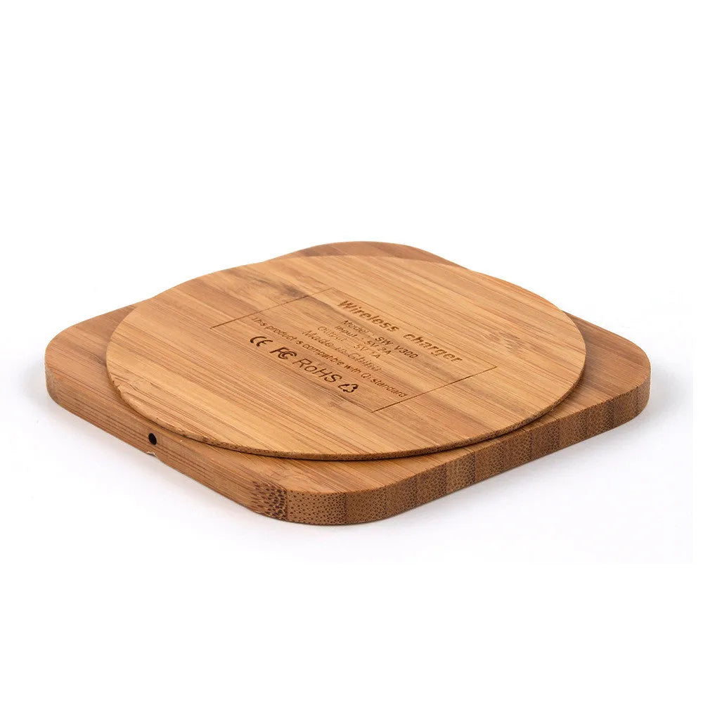 Square brown bamboo 5W wireless charging pad on a wooden table