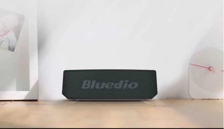 Black cloud smart speaker with 52mm driver showing micro-USB charging port