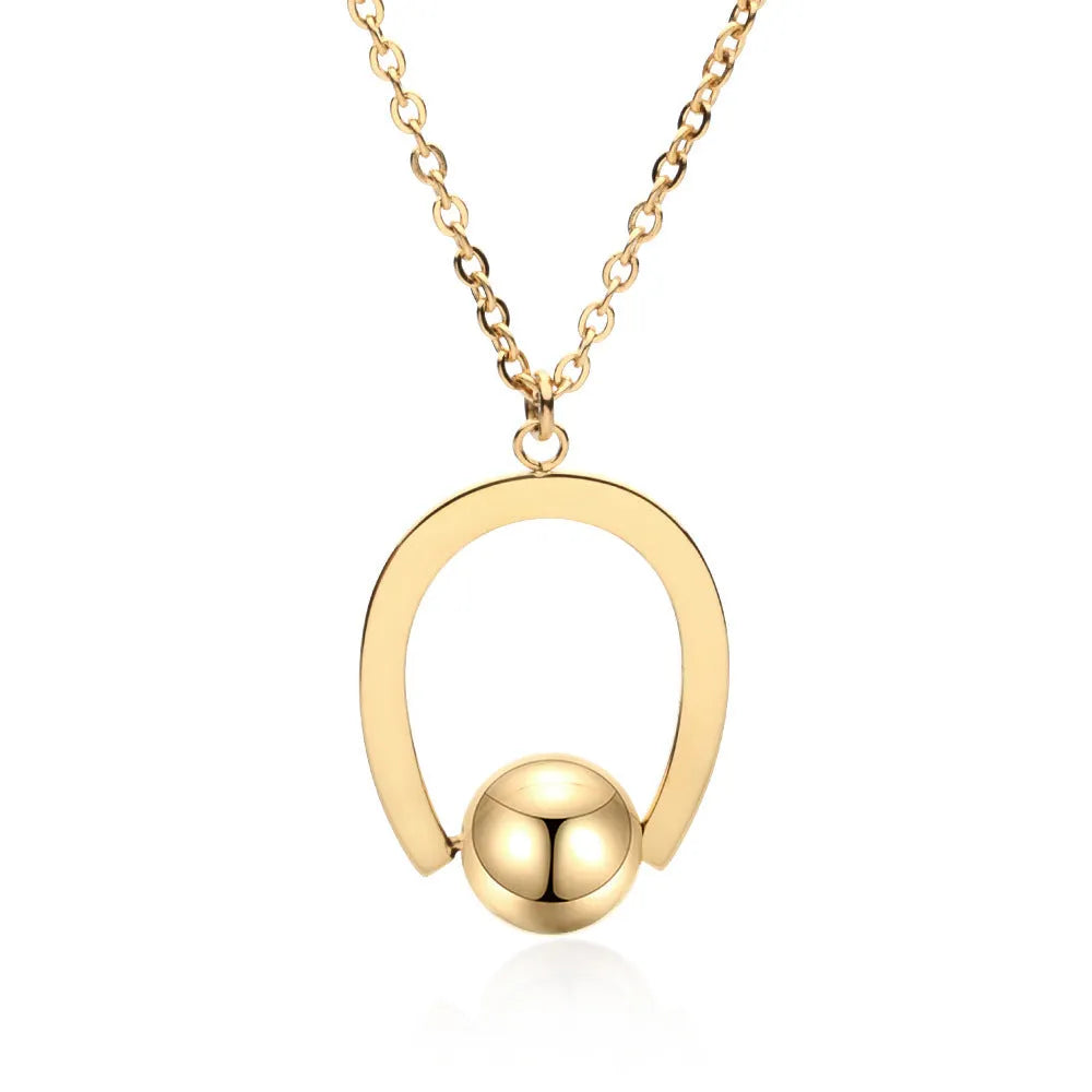 Gold or silver electroplated stainless steel geometric pendant necklace on a cross chain.