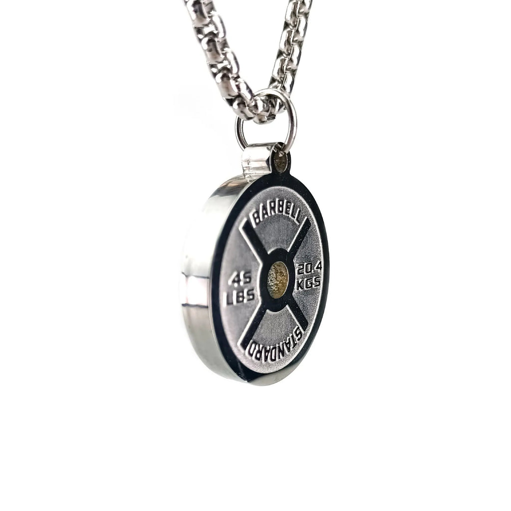 Polished stainless steel barbell disk pendant on a 60cm chain, a fitness-inspired geometric necklace.