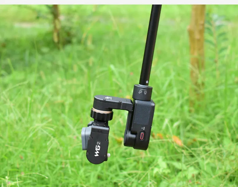Black retractable lengthened selfie stick extended as a hand-held stabiliser
