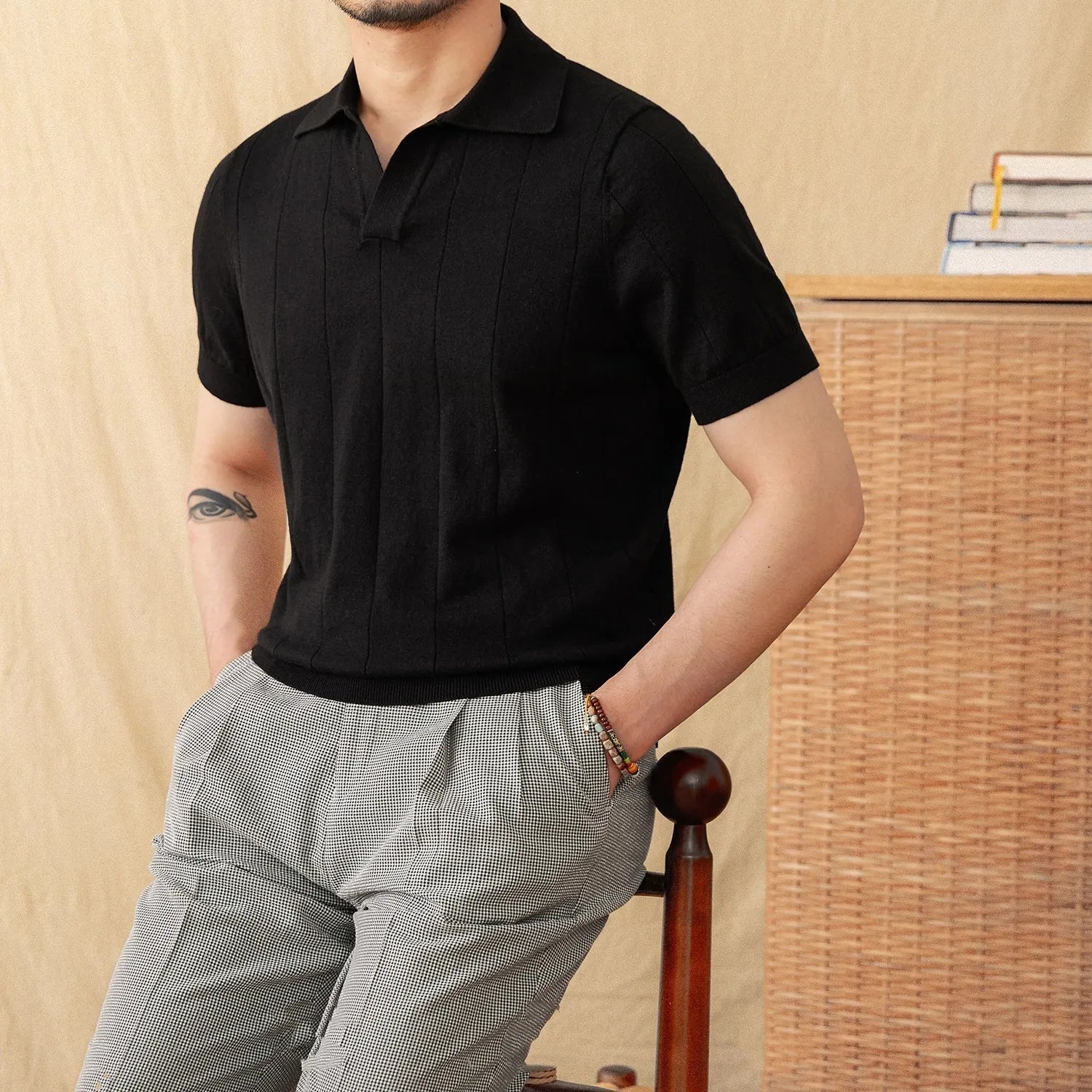 Short sleeve knitted polo shirt in a ramie-cotton blend with a seagull collar, shown in purple.