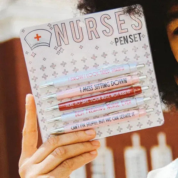 Set of five plastic retractable ballpoint pens with nurse-themed text and slogans.