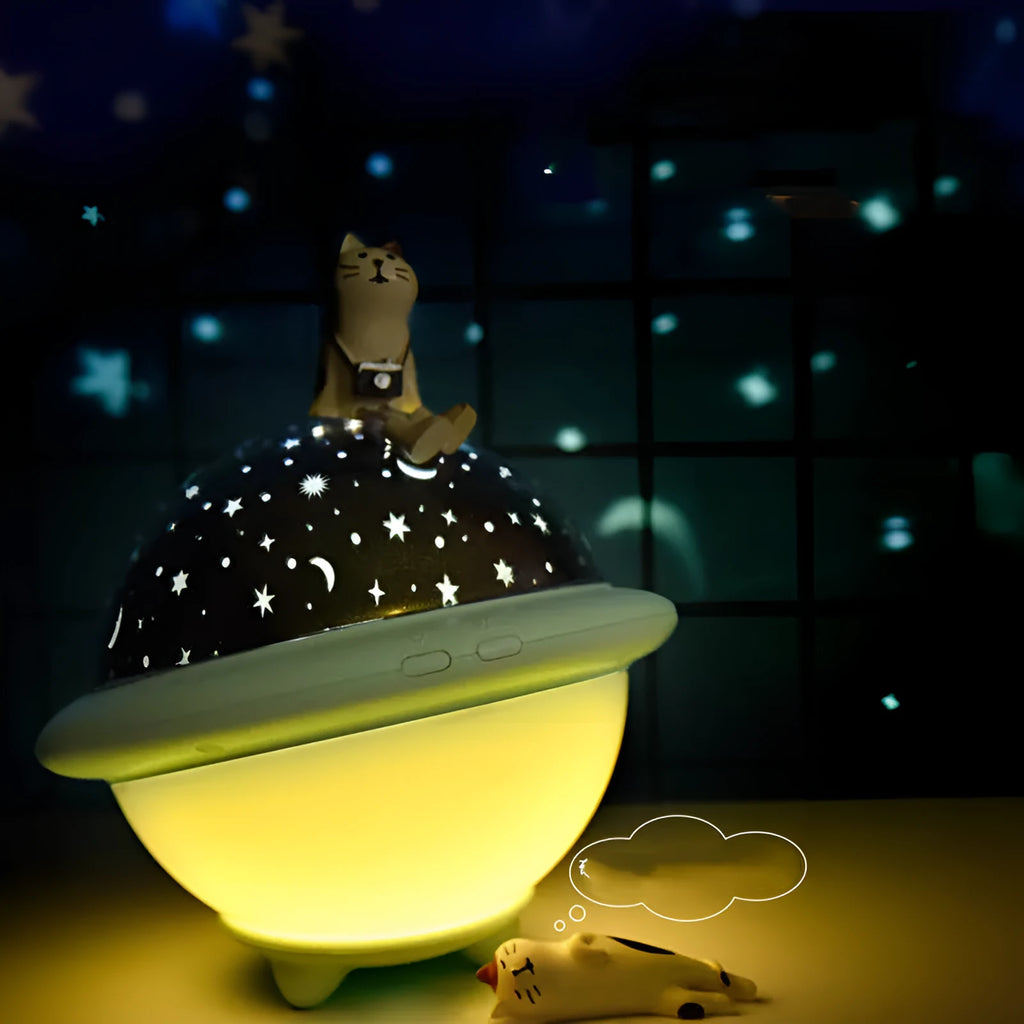 Green UFO-shaped starry sky projection night light with LED lighting on table