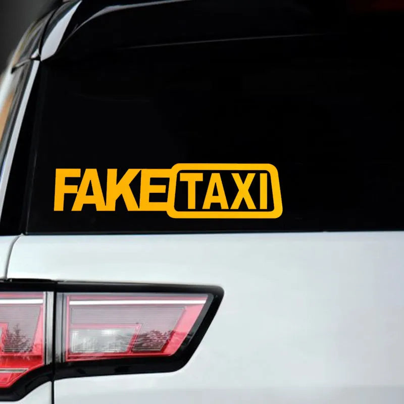 FAKE TAXI car warning sticker in black, white, and yellow, measuring 20cm by 8cm.