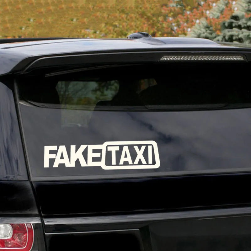 FAKE TAXI car warning sticker in black, white, and yellow, measuring 20cm by 8cm.