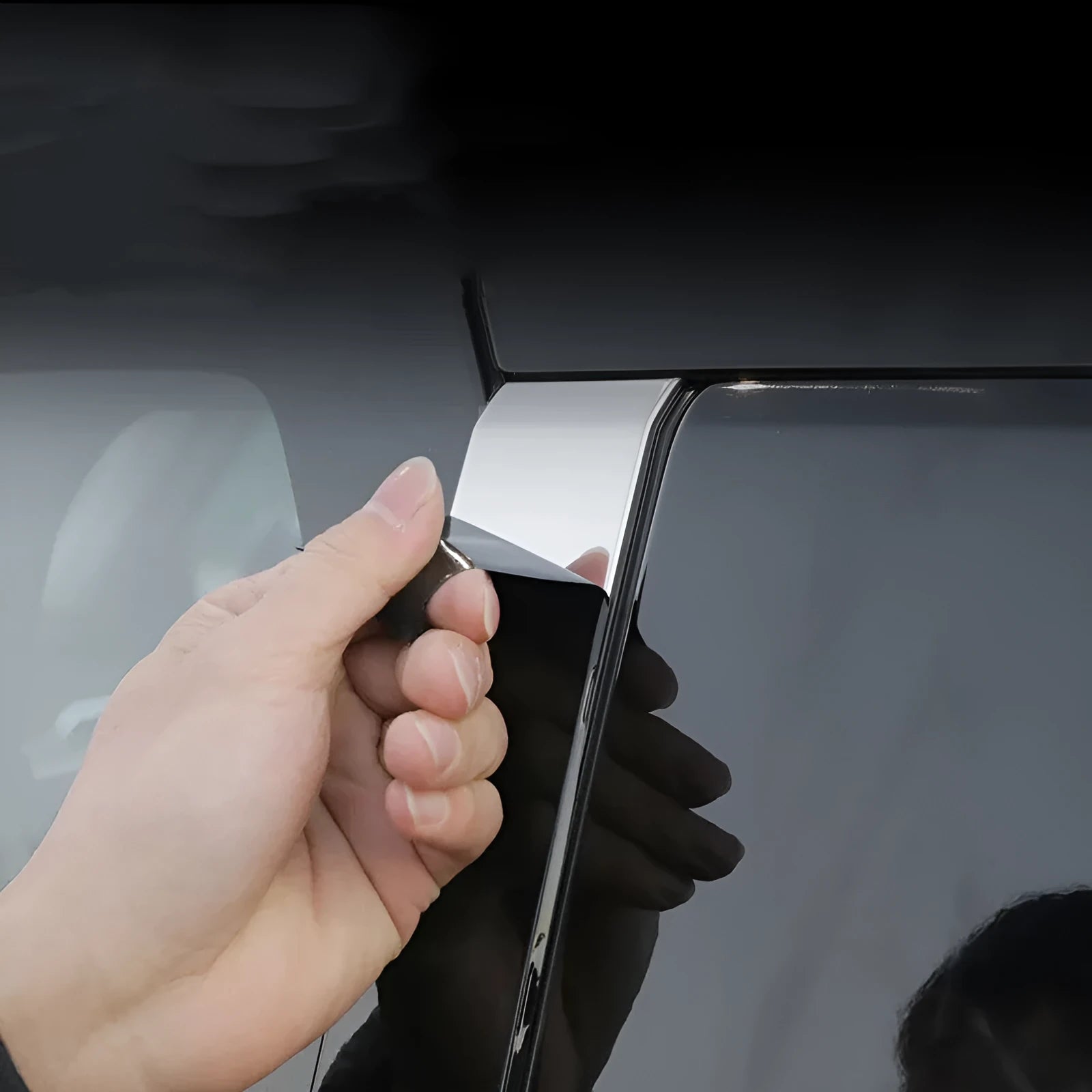 Pre-cut protective films for 23 Outlander window pillars in carbon fibre and bright black finishes.