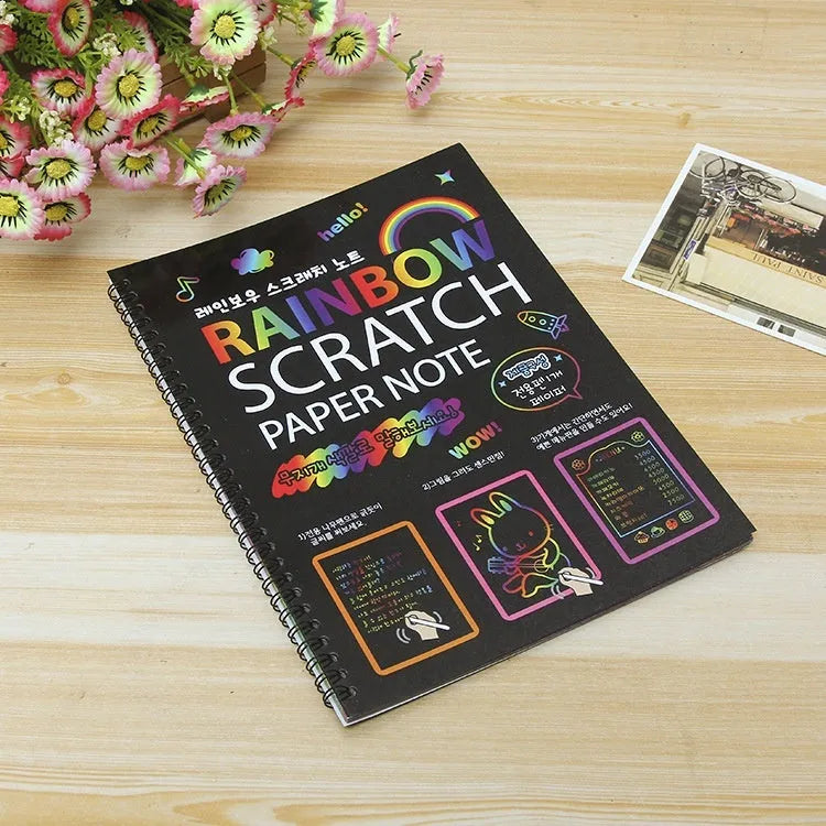 Children's large scratch art paper with colourful revealed designs from scraping activity