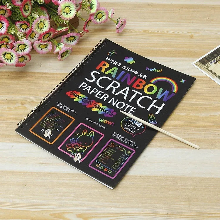 Children's large scratch art paper with colourful revealed designs from scraping activity