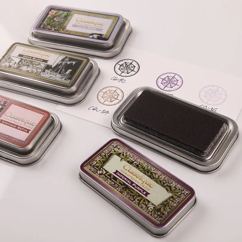 Rectangular stamp pad with oily ink in cocoa brown, fog blue, gray pink, green, and leaf green options