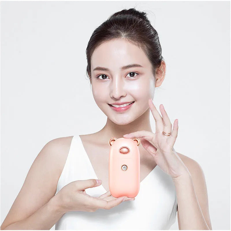 USB rechargeable portable hand humidifier and face steamer in white with cold spray mist