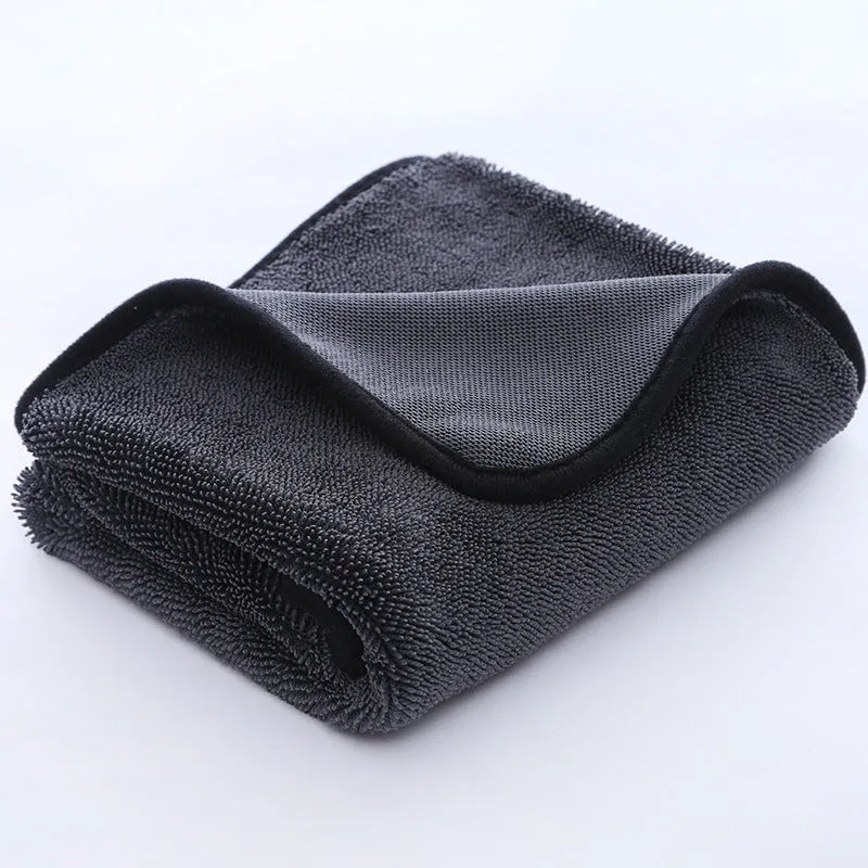 Grey car cleaning cloth with black hemmed edge shown in various sizes for vehicle and pet care.