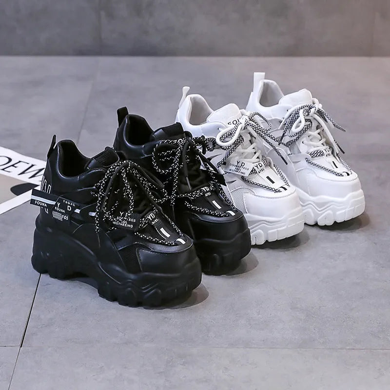 Women's white and black mesh platform sports shoes with cross-strap design and rubber sole