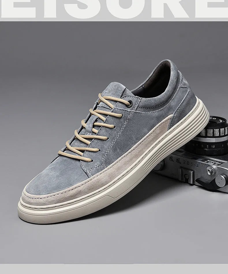 Men's grey low-top casual skate shoes with pigskin upper and rubber sole, shown from the side.