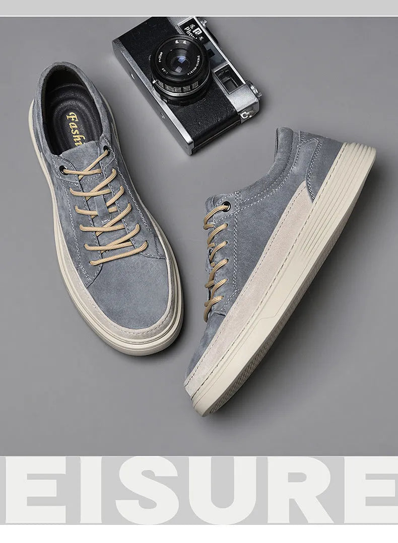 Men's grey low-top casual skate shoes with pigskin upper and rubber sole, shown from the side.