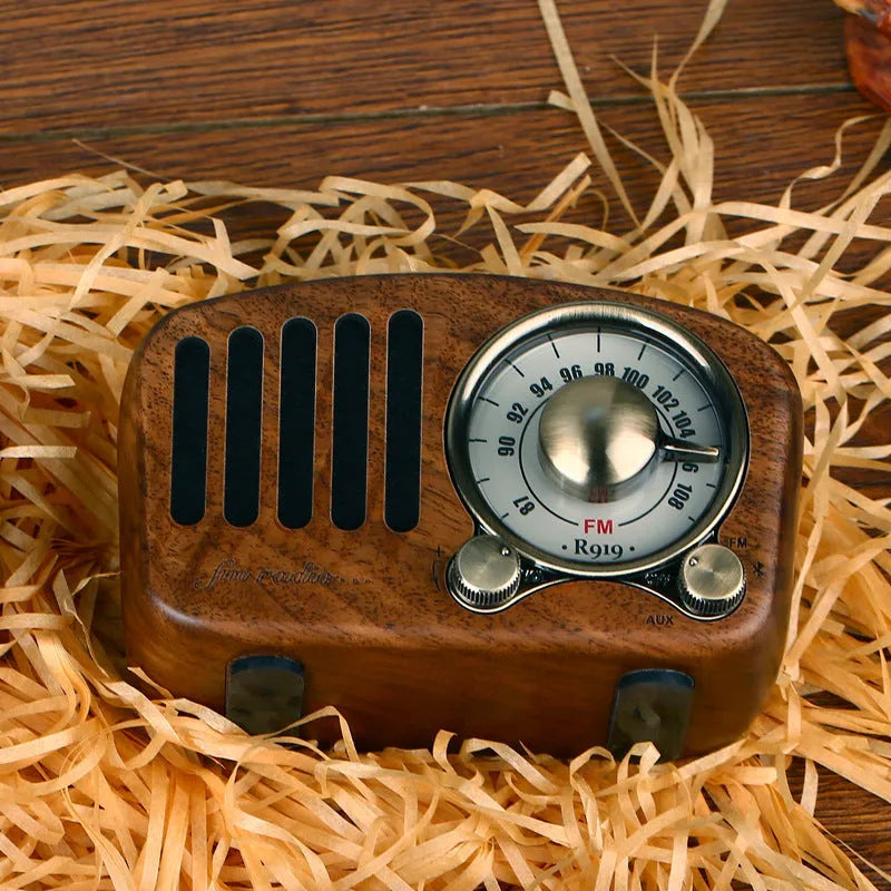Retro style wooden mini wireless Bluetooth speaker in cherry wood or walnut finish.
