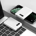 White or black 10000mAh portable power bank with dual USB charging ports