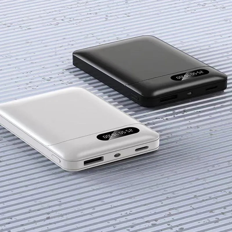 White or black 10000mAh portable power bank with dual USB charging ports