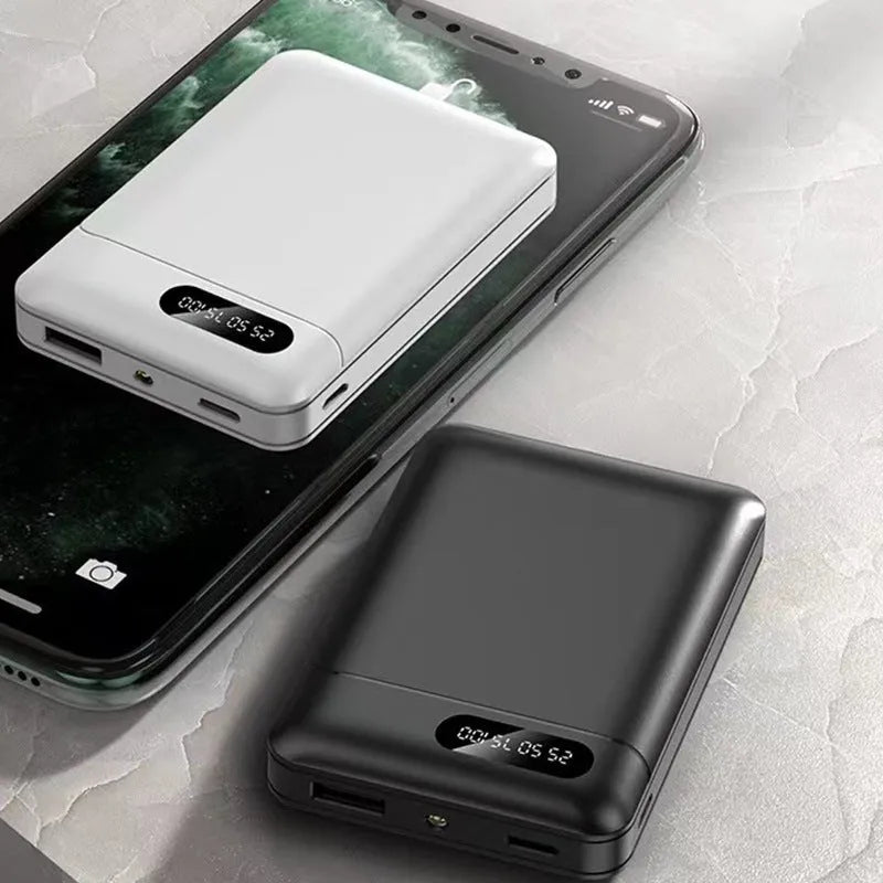 White or black 10000mAh portable power bank with dual USB charging ports