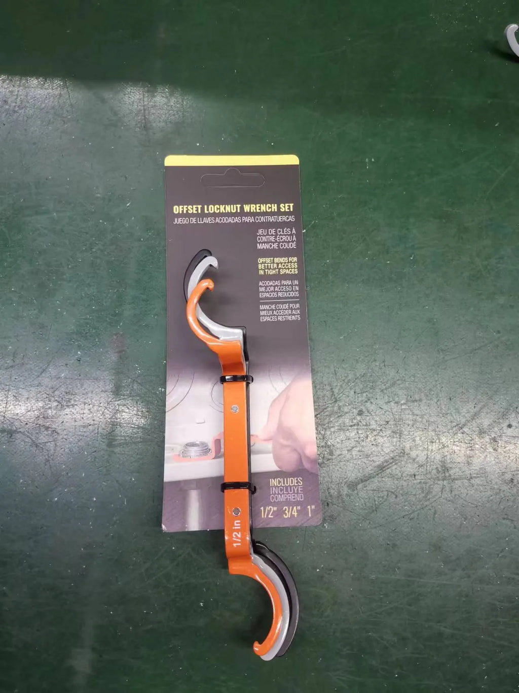 Three magnetic suction wrenches in orange, grey, and black colours with a crescent design.