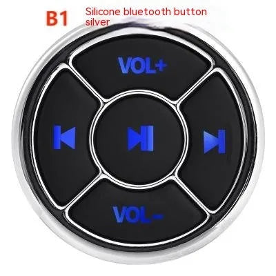 36mm black silicone Bluetooth remote control clipped to a car steering wheel for hands-free phone operation