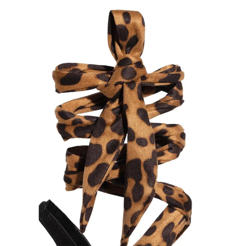 Light brown leopard print women's high heels with cross strap design and fine high heel