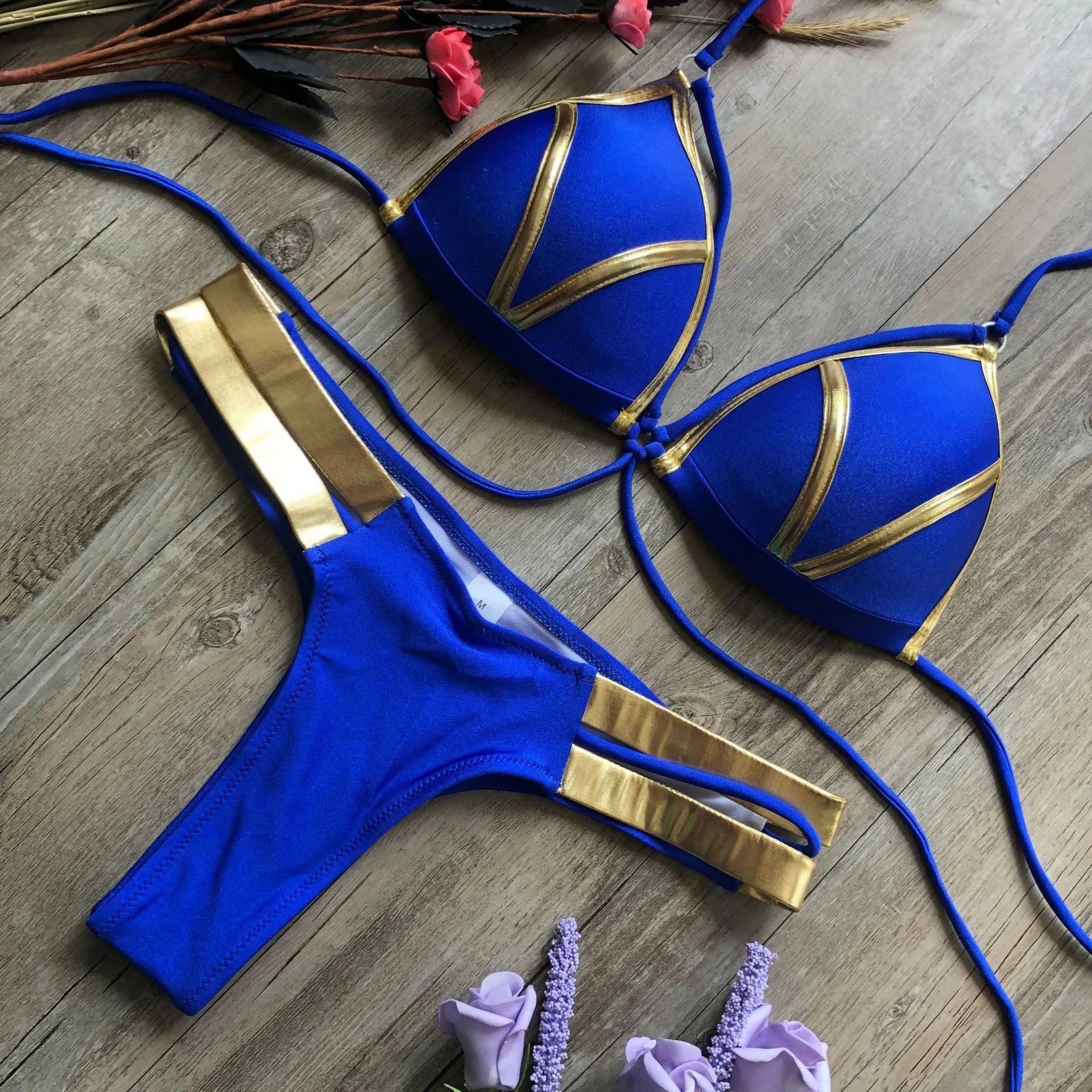 Women's bronzing bikini swimsuit with padded cups, shown in multiple colour and print options including leopard and snakeskin.
