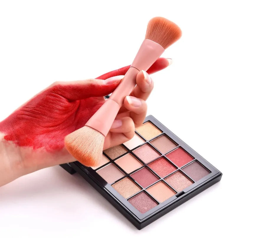 Open case showing 10 pink-handled makeup brushes including loose powder, foundation, flat head, and double-ended brushes.