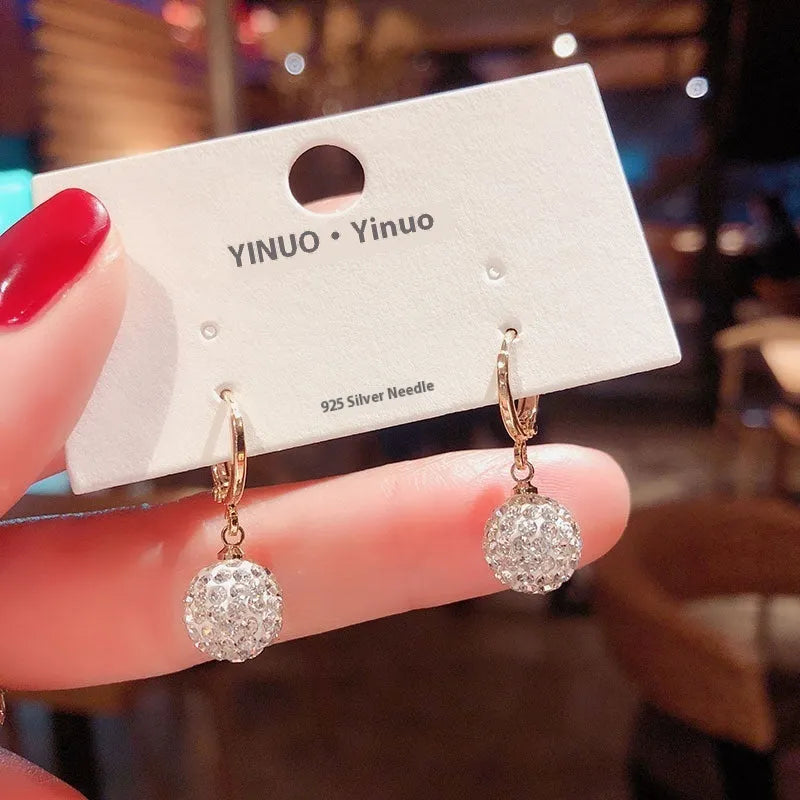 Women's copper geometric drop earrings with rose design and zircon accents in electroplated finish
